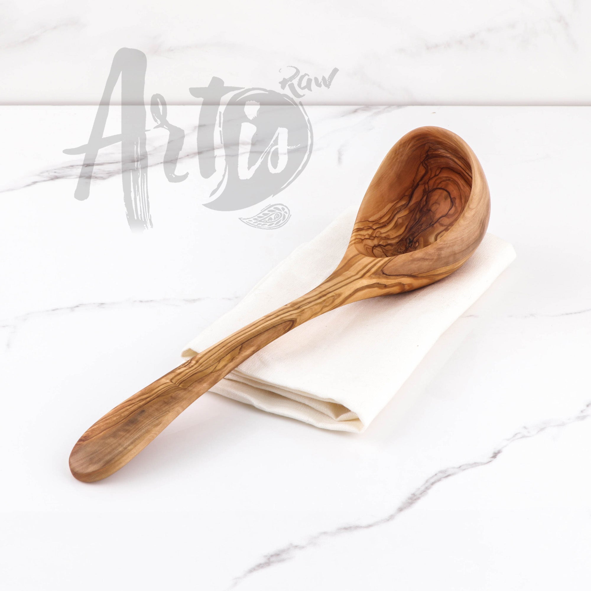 Handmade olive wood ladle spoon, a standout wooden serving spoon for soups and stews. Each spoon, meticulously hand-carved, showcases the unique grain and warm tones of olive wood, making it a one-of-a-kind piece of wooden flatware. Durable and naturally antibacterial, it's an eco-friendly choice for those valuing beauty and sustainability in their kitchen utensils.